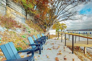 A waterfront bench area with a view of the water and a dock. - Contemporary 2BR Lakefront Finger Lakes (Dundee)