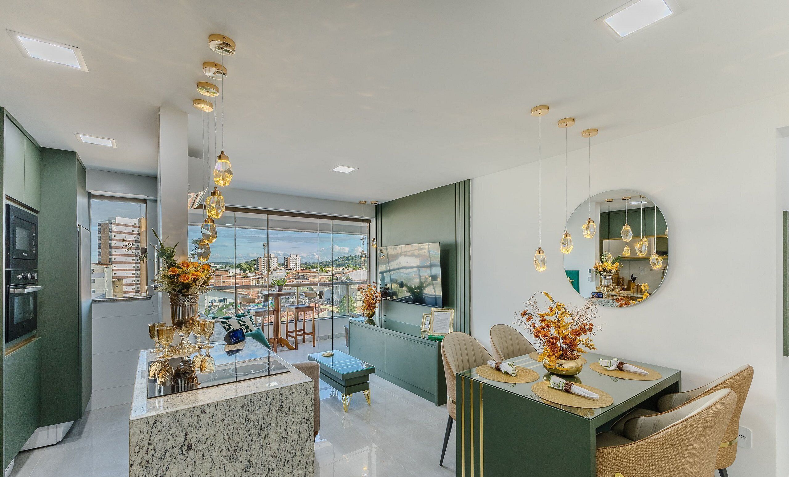A modern living room with a large window, a dining area, and a kitchen.