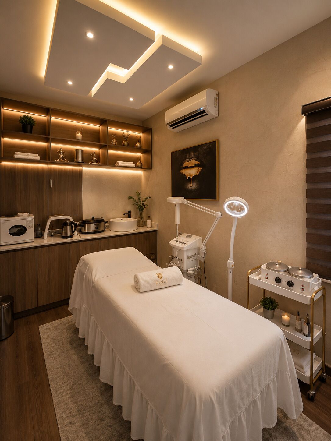 A modern, well-lit room with a bed, a vanity area, and a kitchenette.