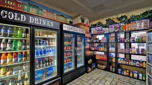 A convenience store with refrigerated sections for cold drinks and a general store area with snacks and beverages. - Marriott's Summit Watch (Park City)