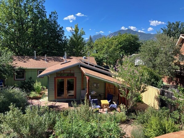A house with a patio, a covered area, and a mountain view. - artist's home (Boulder)