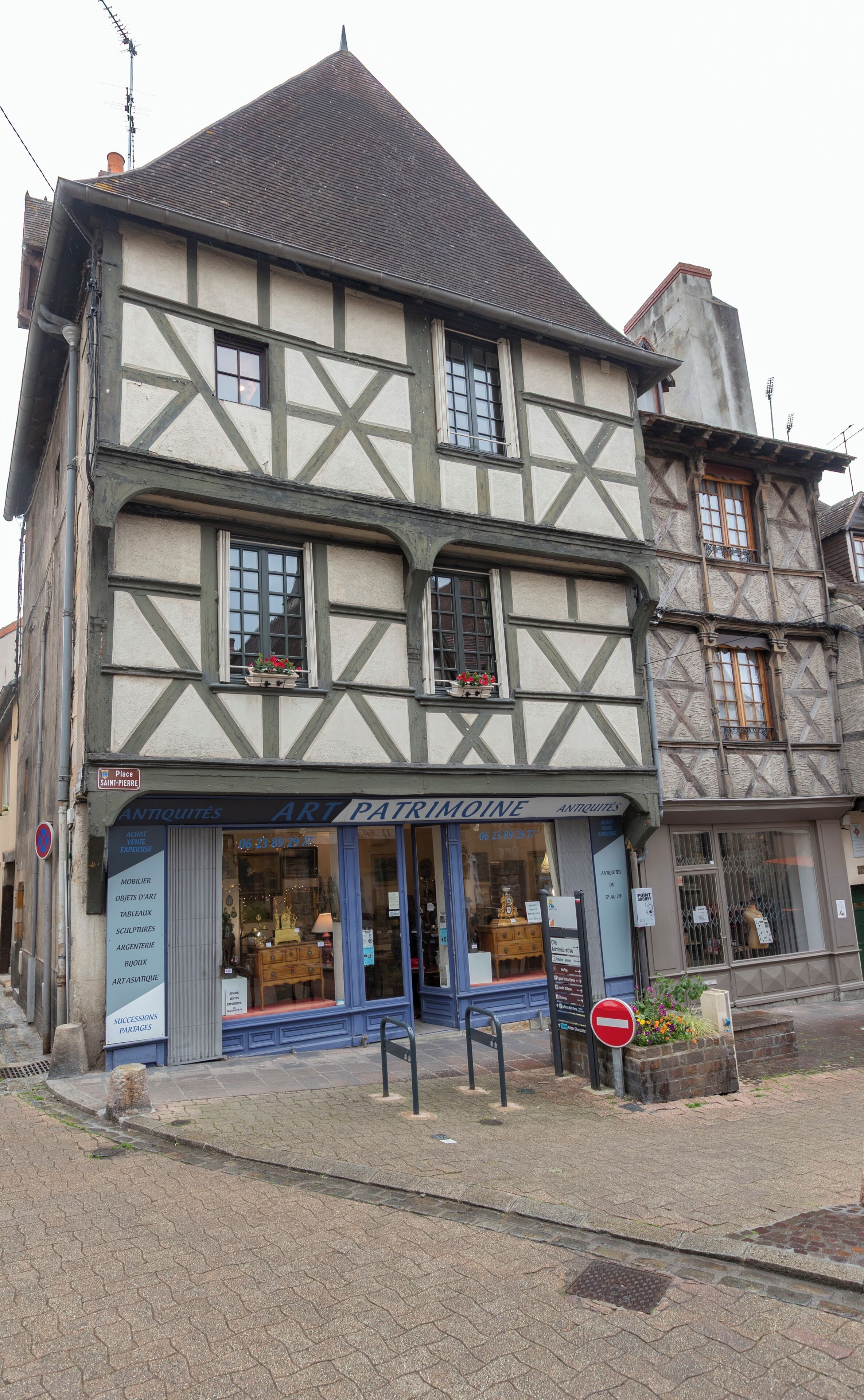 A traditional half-timbered building with a ground-floor shop.