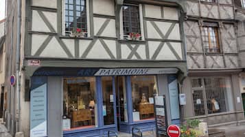 A traditional half-timbered building with a ground-floor shop.