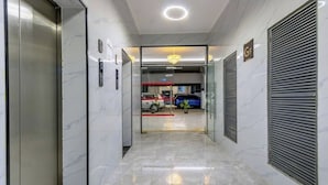 A modern elevator with a marble wall and a closed shutter on the right. - Nairobi City -kilimani Next to Junction Mall (Nairobi)