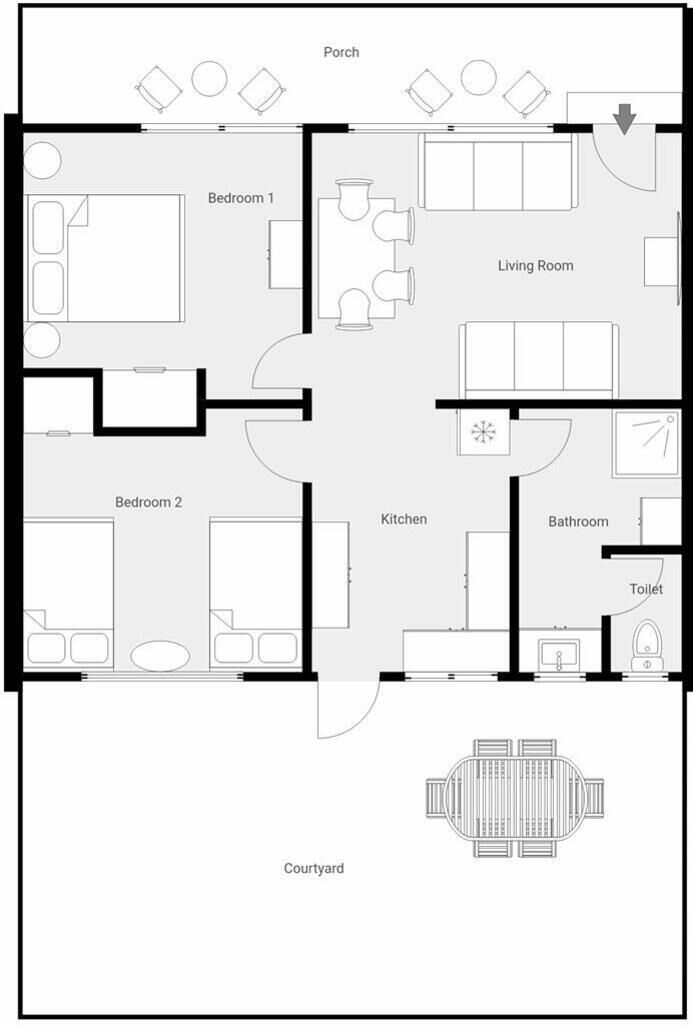 A floor plan of a hotel with two bedrooms, a living room, kitchen, bathroom, and a courtyard.