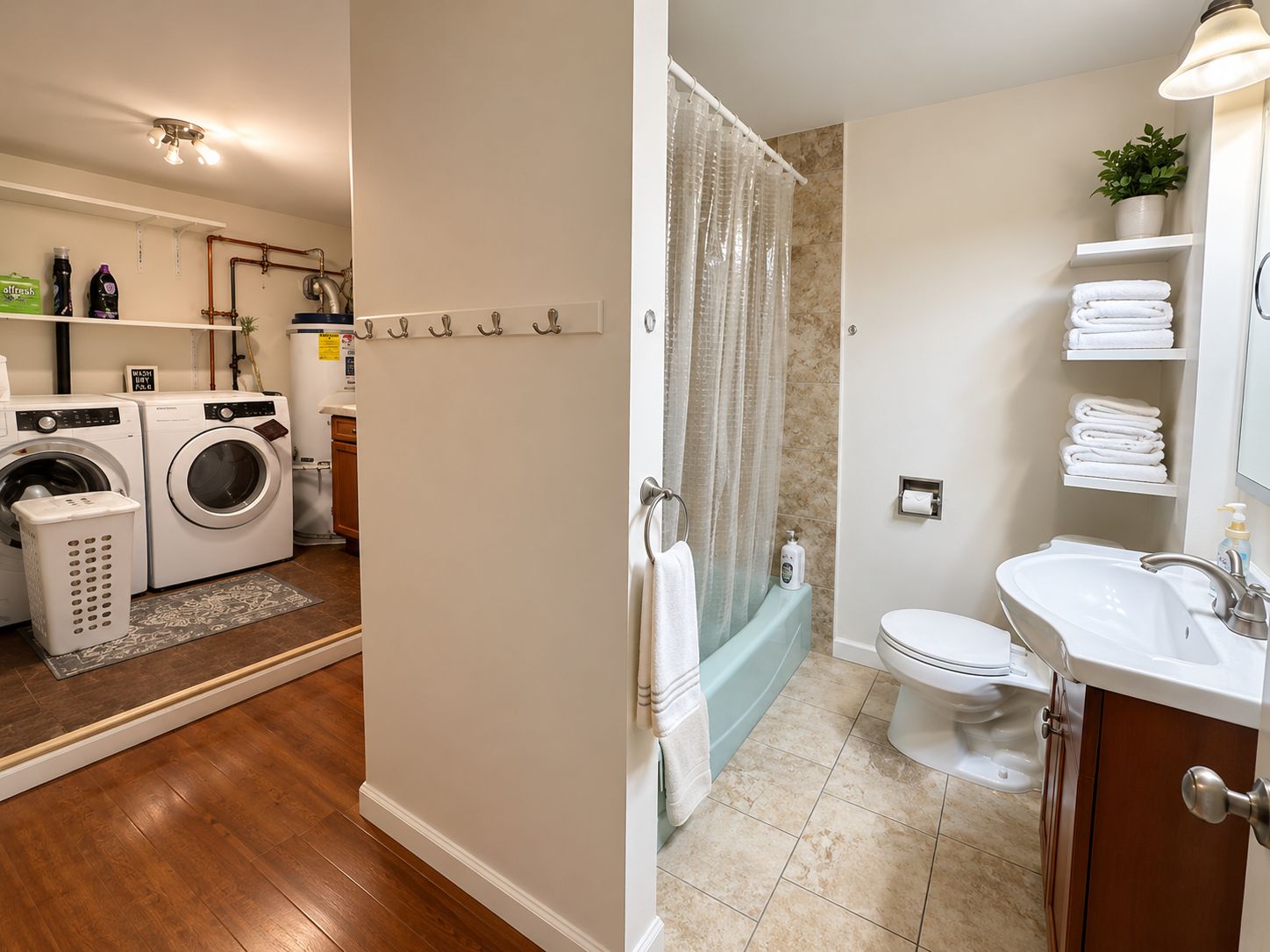 A modern bathroom with a toilet, sink, and bathtub.