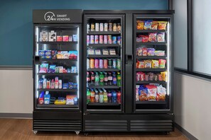 A 24-hour vending machine with various snacks, drinks, and personal care items. - StudioRes By Marriott Clarksville (Clarksville)