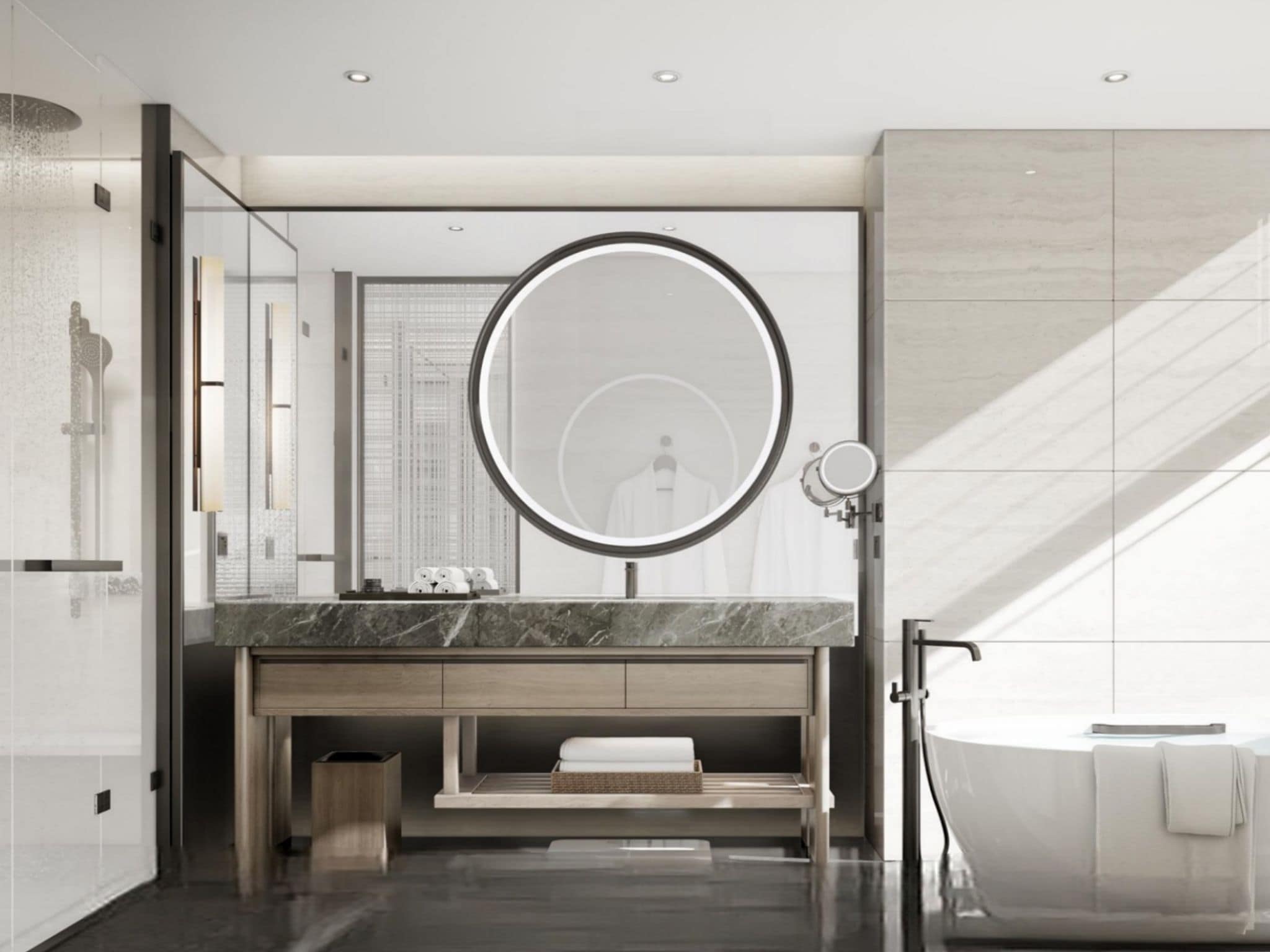 Un baño moderno con un espejo grande, una bañera y un tocador con encimera de mármol.