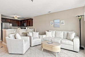 A modern living room with a sofa, armchairs, and a coffee table. - Oceanview Pool Beach Stay @Villa Capriani 3 Kings (North Topsail Beach)