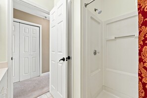 A bathroom with a shower, a toilet, and a sink. - Oceanview Pool Beach Stay @Villa Capriani 3 Kings (North Topsail Beach)