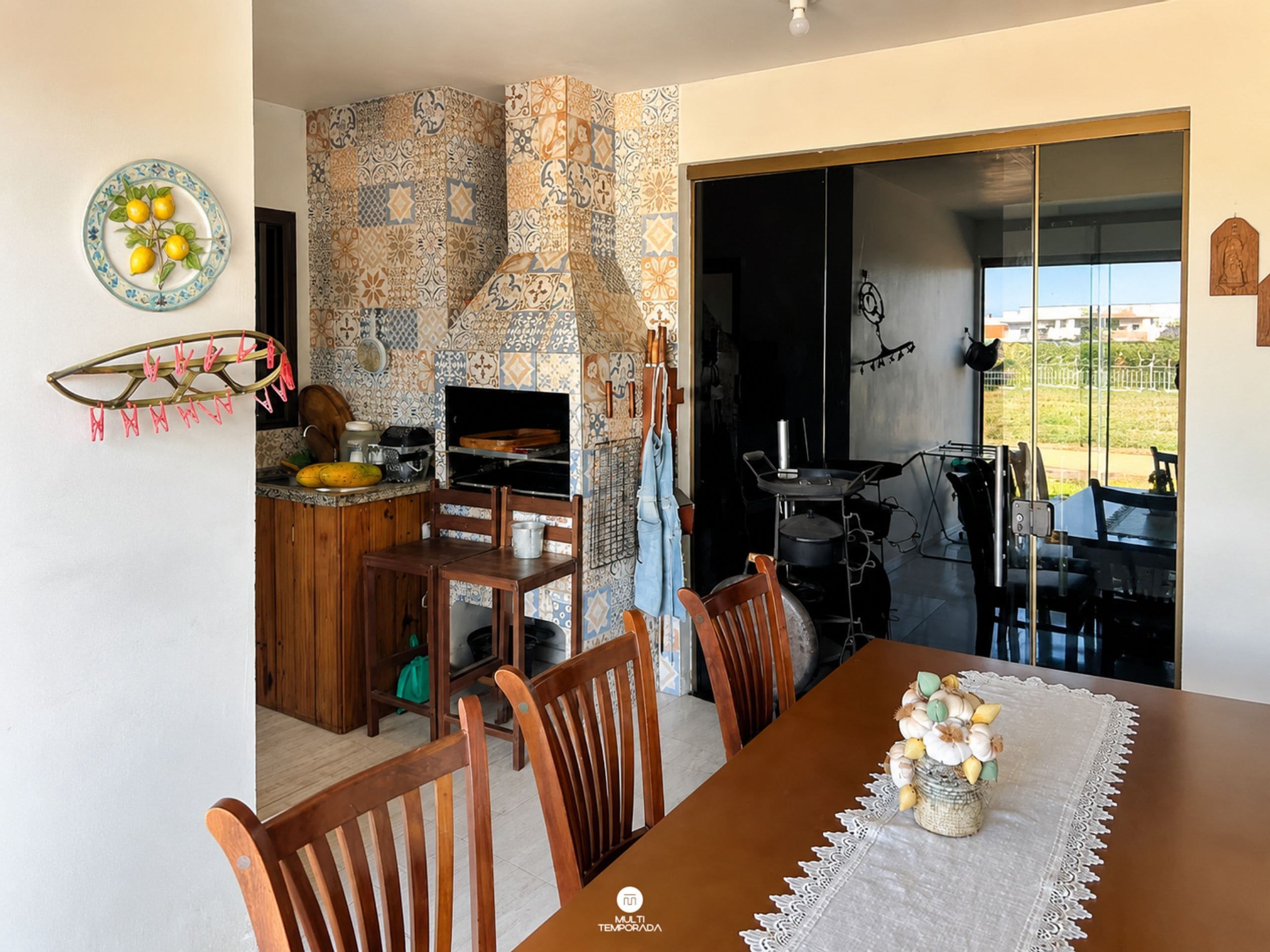 A dining area with a wooden table, chairs, and a decorative vase.