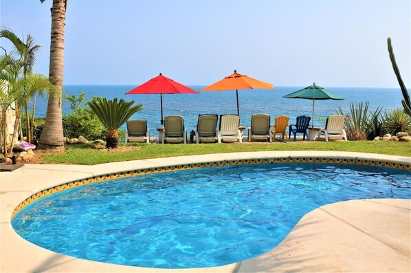 The community pool and lawn, looking out over the Pacific.