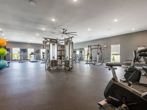 A gym with various exercise equipment, including a treadmill, stationary bikes, and weight machines. - 1 -3-bedroom Single Family Residence house in perfect Oklahoma City (Oklahoma City)