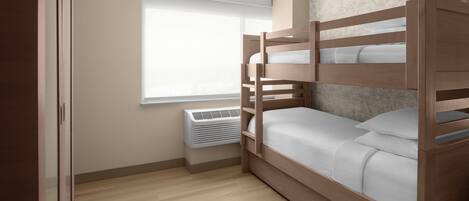 A bunk bed with a white mattress and pillows, a window with blinds, a wall-mounted air conditioner, and a wooden floor.