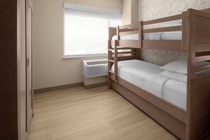 A bunk bed with a white mattress and pillows, a window with blinds, a wall-mounted air conditioner, and a wooden floor. - Springhill Suites By Marriott Anaheim Theme Park / Convention Area (Anaheim)