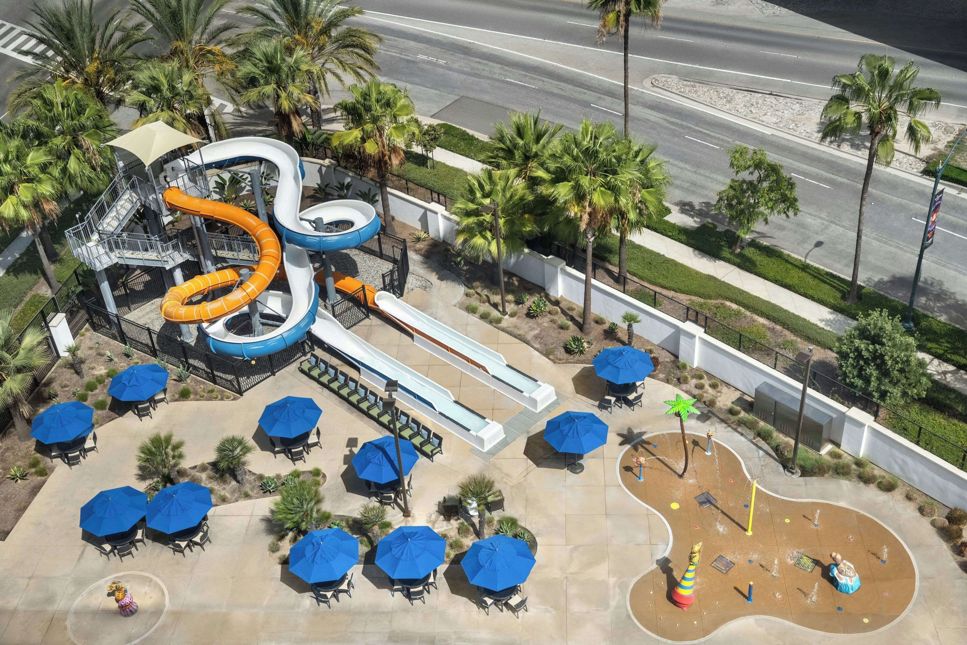 A water park with multiple slides and a pool area.
