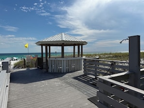 A wooden boardwalk leading to a beach gazebo with a view of the ocean. - NEW! • Lakefront • Short Walk to Private Beach • Monthly Snowbird Discounts (Destin)