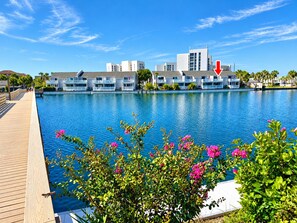 A resort with a pool, wooden deck, and modern buildings. - NEW! • Lakefront • Short Walk to Private Beach • Monthly Snowbird Discounts (Destin)