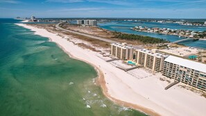A coastal hotel with multiple buildings, a beach, and a pier. - Gulf Front | Huge Balcony | Direct Beach Access | BEACHBALL PROPERTIES (Orange Beach)