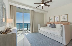 A hotel room with a balcony, a bed, a ceiling fan, and artwork on the wall. - Breathtaking, rare 3-bedroom condo at Luxury Amrit Ocean Resort on Singer Island (Singer Islad)