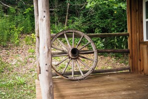 A wooden structure with a large, weathered wagon wheel. - Welcome to the Sheriff's Office (Stanton)