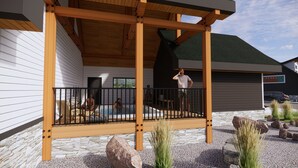 A wooden deck with a pool, surrounded by stone and rock landscaping. - Separate-Address Combo • Hot Tub • Parking • Air Conditioner, Sleeps up to 17 (Harvie Heights)
