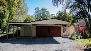 A single-story building with a covered garage and a small attached structure. - Hop, Skip and a Jump - Entire vacation home on acreage (Landsborough)