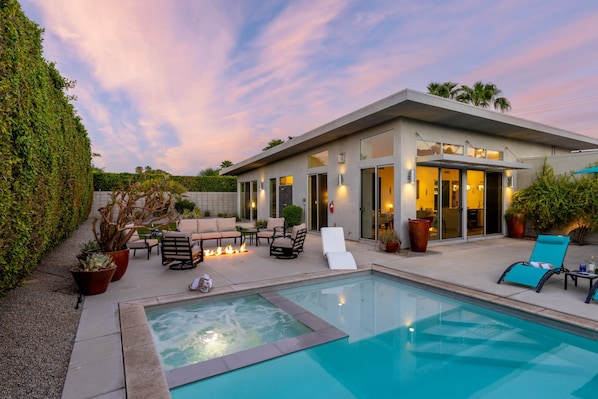 A modern house with a swimming pool, outdoor seating, and a well-maintained garden. - Flamingo Oasis | Private Pool & Spa | Firepit | Sleeps 6 (Palm Springs)