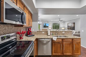 A modern kitchen with a built-in oven, microwave, and dishwasher. - Horizon Hideaway | Balcony | Pool & Spa | North Scottsdale (Scottsdale)