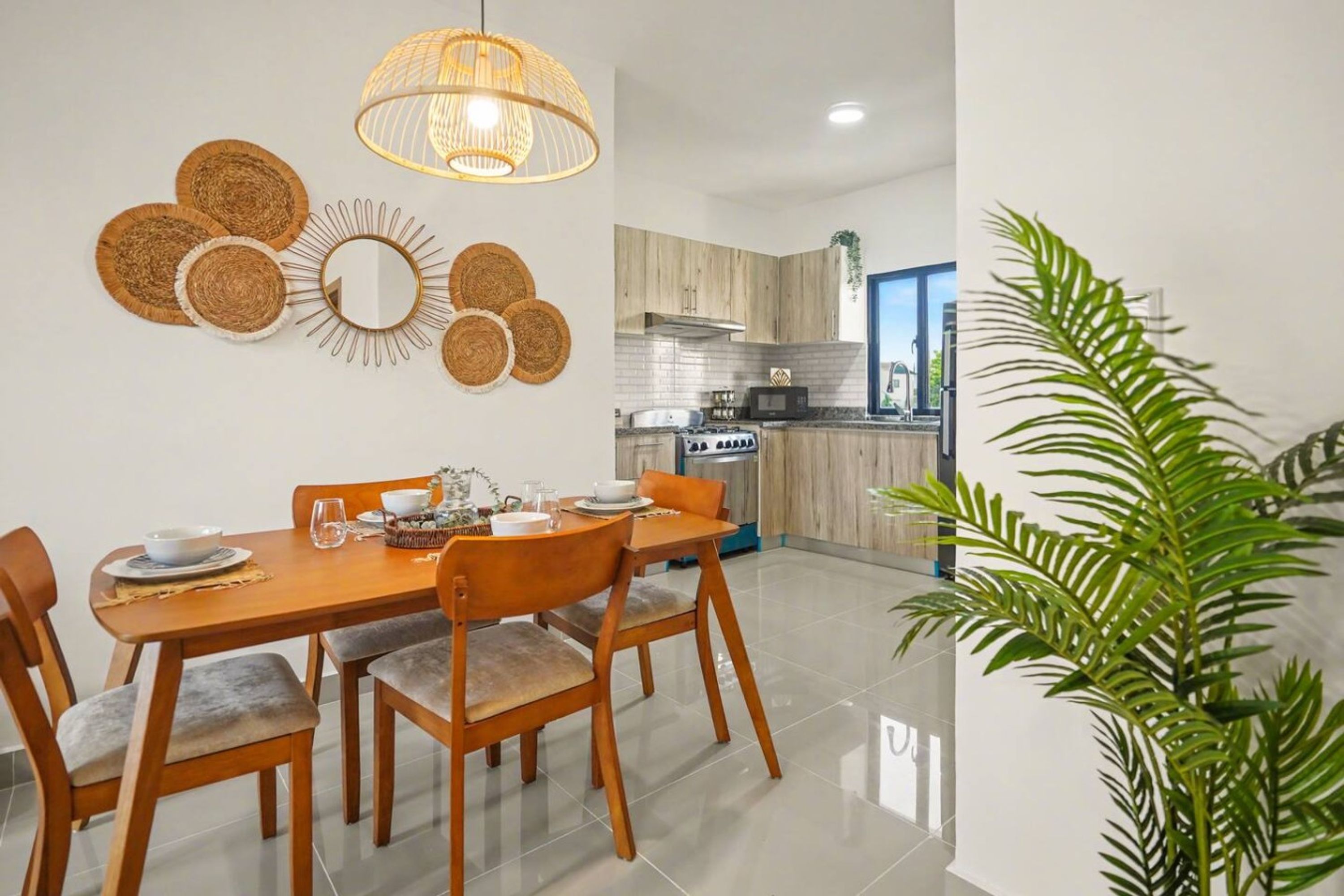 A modern kitchen with wooden cabinets, a built-in oven, and a microwave.