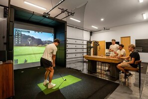 Take your stance and get ready to swing at the simulator. - Paradise Reserve | Luxe Pool, GolfSim & Pickleball (Scottsdale)