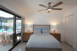 A bedroom with a bed, nightstands, and a ceiling fan. - Terra Nova at Delray Beach - Minutes To Beach & Atlantic Avenue (Delray Beach)