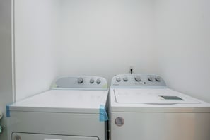 Two white Whirlpool dryers side by side in a laundry room with a plain white wall. - Upper Westside Home w/ Deck - 3 Mi to Dtwn! (Atlanta)