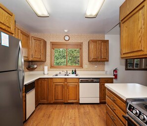 The cozy kitchen is well equipped for an unforgettable getaway​ - Aspen Glen Mountain Escape (Green Valley Lake)