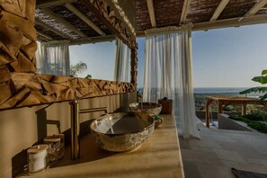 A bathroom with a large basin, a towel rack, and a view of the ocean. - AETHER - Romantic Private Pool Villa with Spectacular Ocean Views (Corfu)