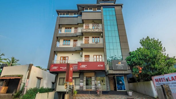 A multi-story building with signage for Kerala Bank and Kerala State Bank ATMs. - Chaithanya Residency  (Kochi)