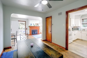 A spacious kitchen with white cabinets, a microwave, and a stove. - Family Apt 7 Mi to Gateway Arch, Museums & More! (St. Louis)