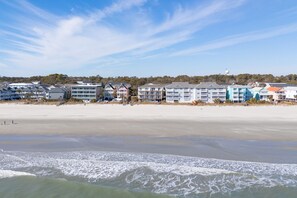 A beachfront hotel with multiple-story buildings, a sandy beach, and ocean waves. - 2BR Oceanfront Condo with Elevator and Shared Pool! South Shores II 203 (Surfside Beach)