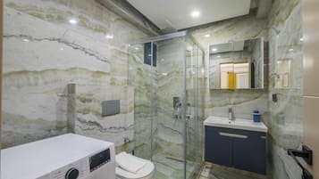 Standard Condo, Balcony, City View | Bathroom | Shower, hair dryer, towels, soap