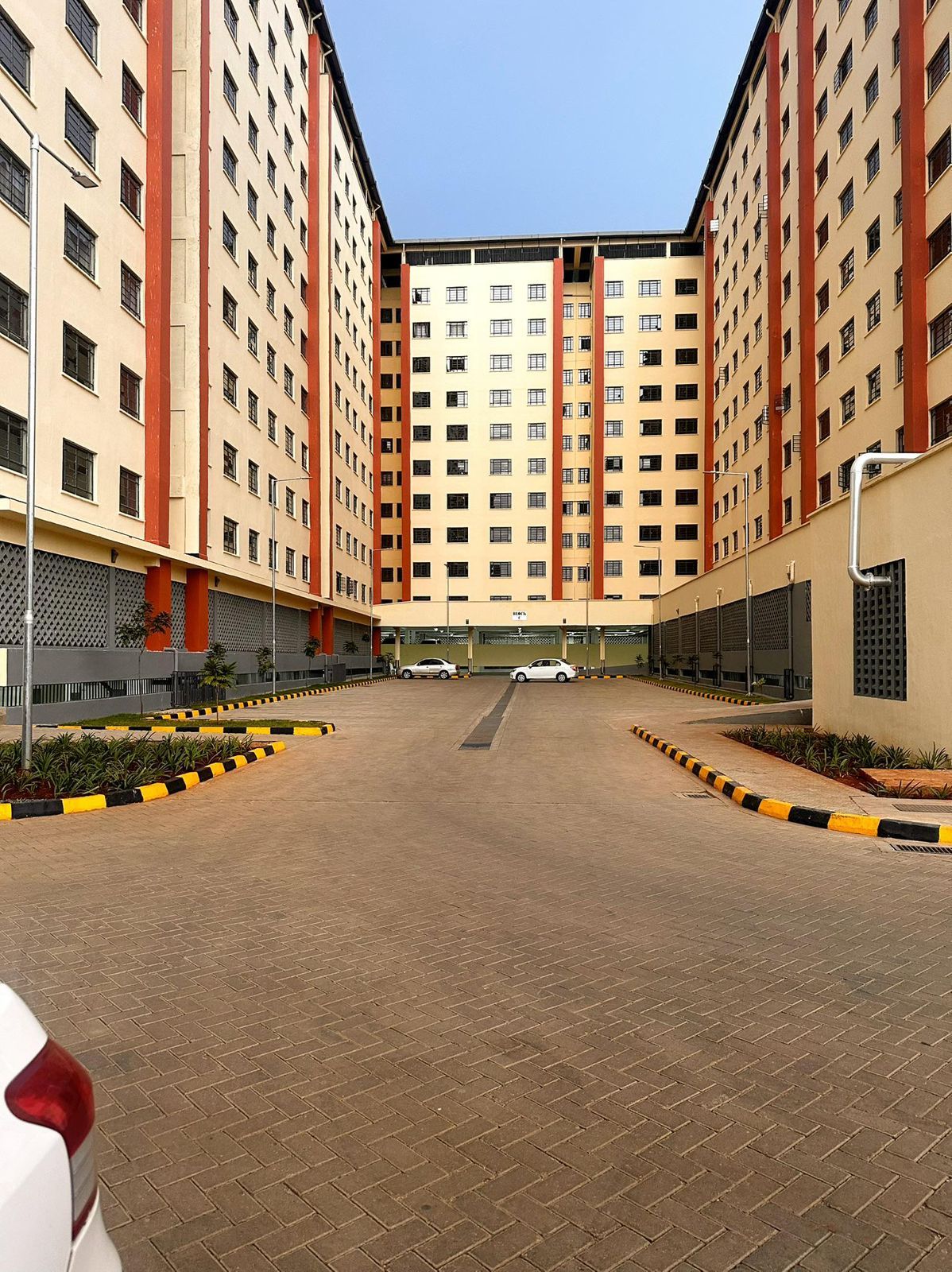 A multi-story residential building with a central courtyard.
