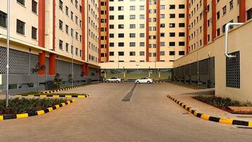 A multi-story residential building with a central courtyard.