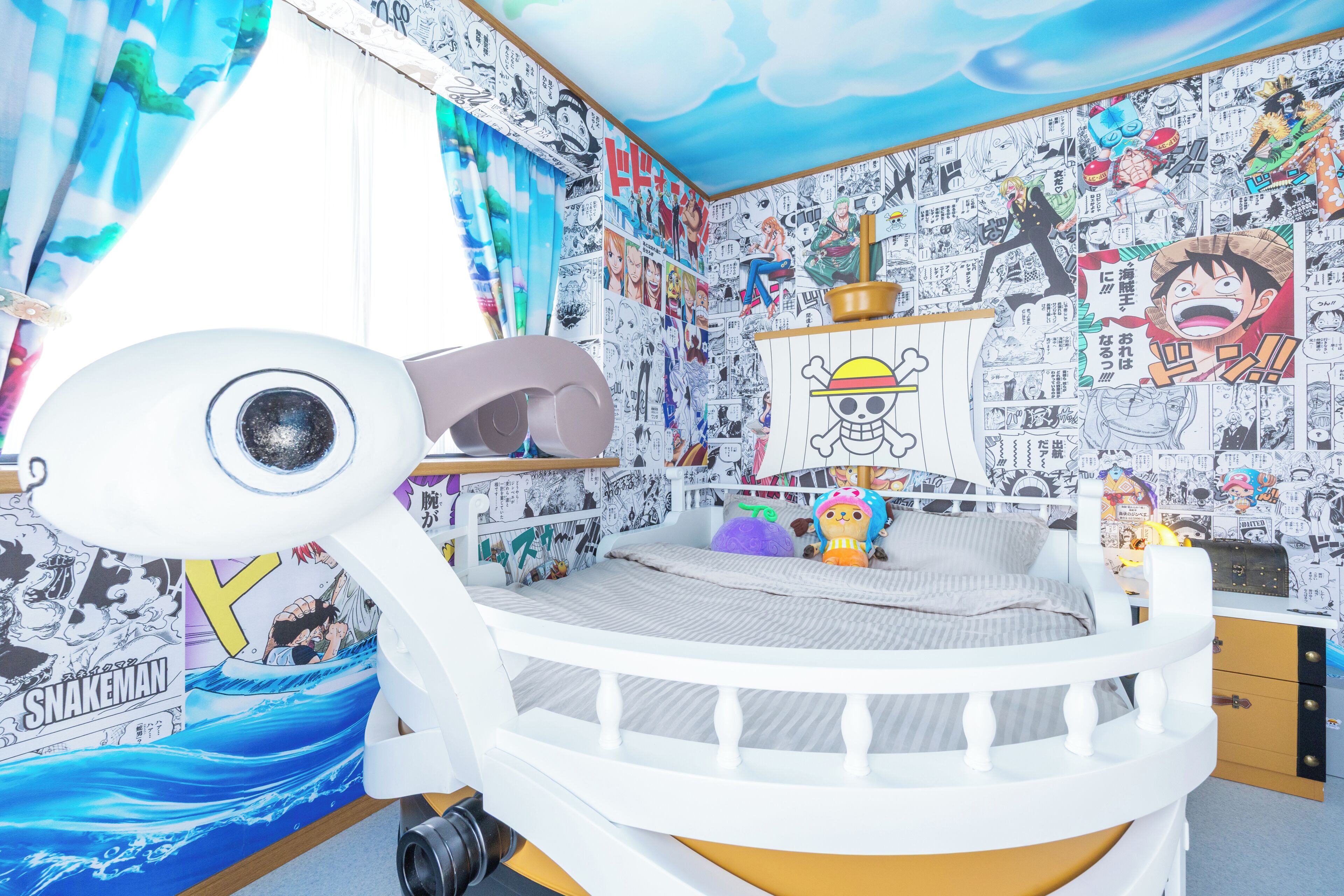 A child's room with a bunk bed, manga posters on the walls, and a ceiling mural.