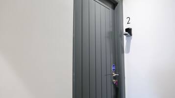 A door with a number '2' on the wall beside it.
