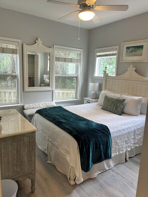 A bedroom with a bed, bedside tables, a dresser, a ceiling fan, and windows with blinds. - Charming 30A Beach Home, 5Min walk to Gulf, on front of the community pool, A/C (Santa Rosa Beach)