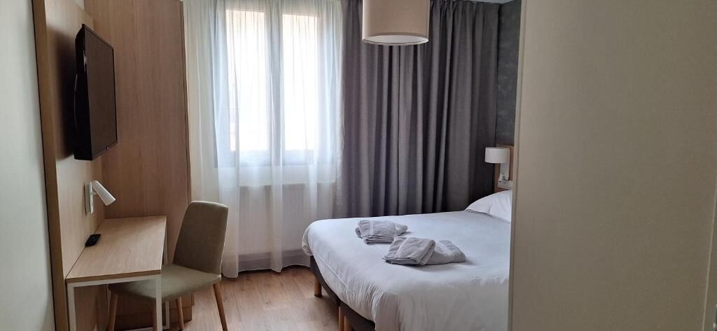 Desk, blackout drapes, soundproofing, iron/ironing board (on request)