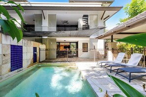 A residential property with a swimming pool, outdoor seating, and a covered patio area. - Temple Escape 3 Bed Apartment with Private Pool (Craiglie)
