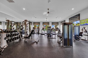 A gym with various exercise equipment, including dumbbells, weight machines, and cardio machines. - Private pool, resorts, 9 minutes to Disney (Kissimmee)