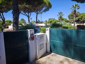 A gated entrance with a security panel and a number sign indicating the location. - Charming home in the Algarve near the best golf courses (Olhos de Água)