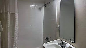A bathroom with a shower, a sink, and a mirror. - Easygoing Pasco Stay Near Family Fishing Pond & Columbia River Walks (Pasco)