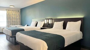 A hotel room with two beds, a desk, and a large window with curtains. - 3 Budget-Friendly Rooms | Redondo Beach Station - 3 miles | Pets Allowed (Gardena)